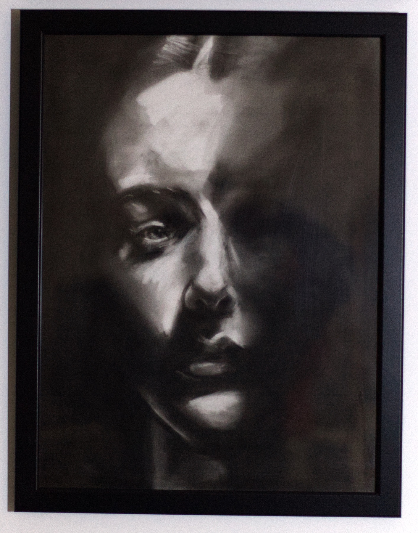 Split Light, a close portrait whose face emerges halfway from deep shadow