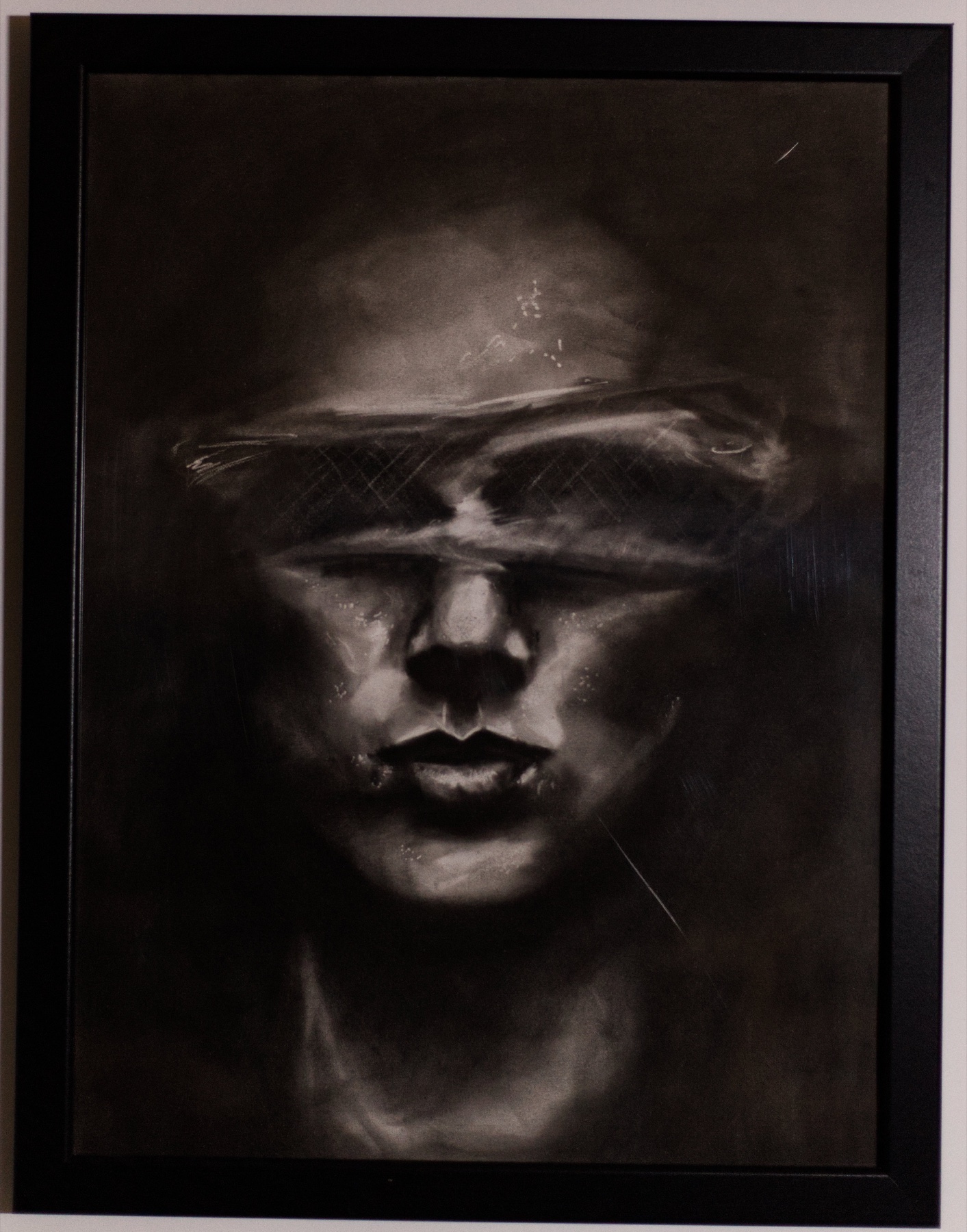 Veiled Presence, a monochrome portrait crossed by a horizontal band of light